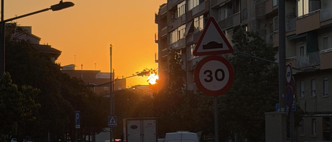 The sun setting in the Nou Barris neighborhood in Barcelona, Spain.