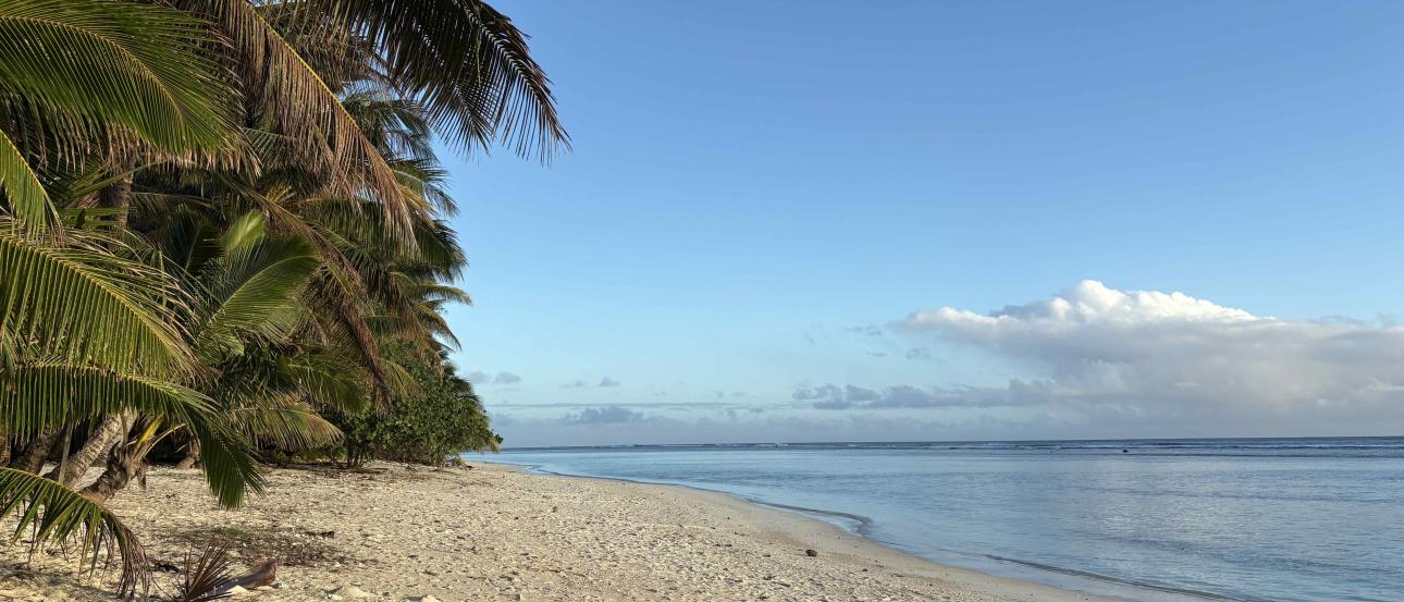 A flat, white sand beach coast