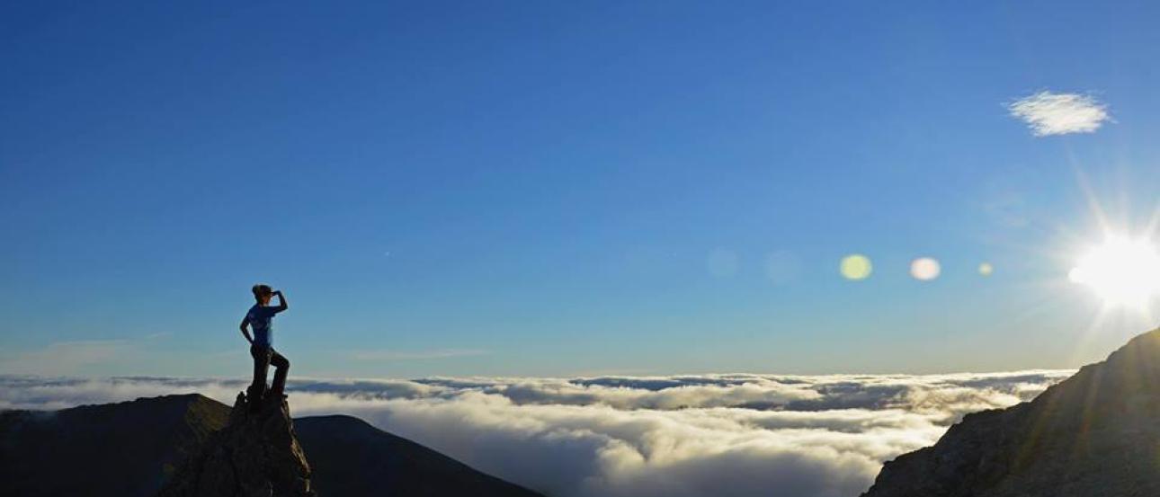 1. Cityscape with red roofs, green hills, and cloudy sky.
2. Graffiti-covered wall with colorful artwork.
3. Snowy mountain landscape under a sunny sky.
4. Person standing on mountain peak above clouds against the sun. This alt text was added with Al; accuracy may vary.