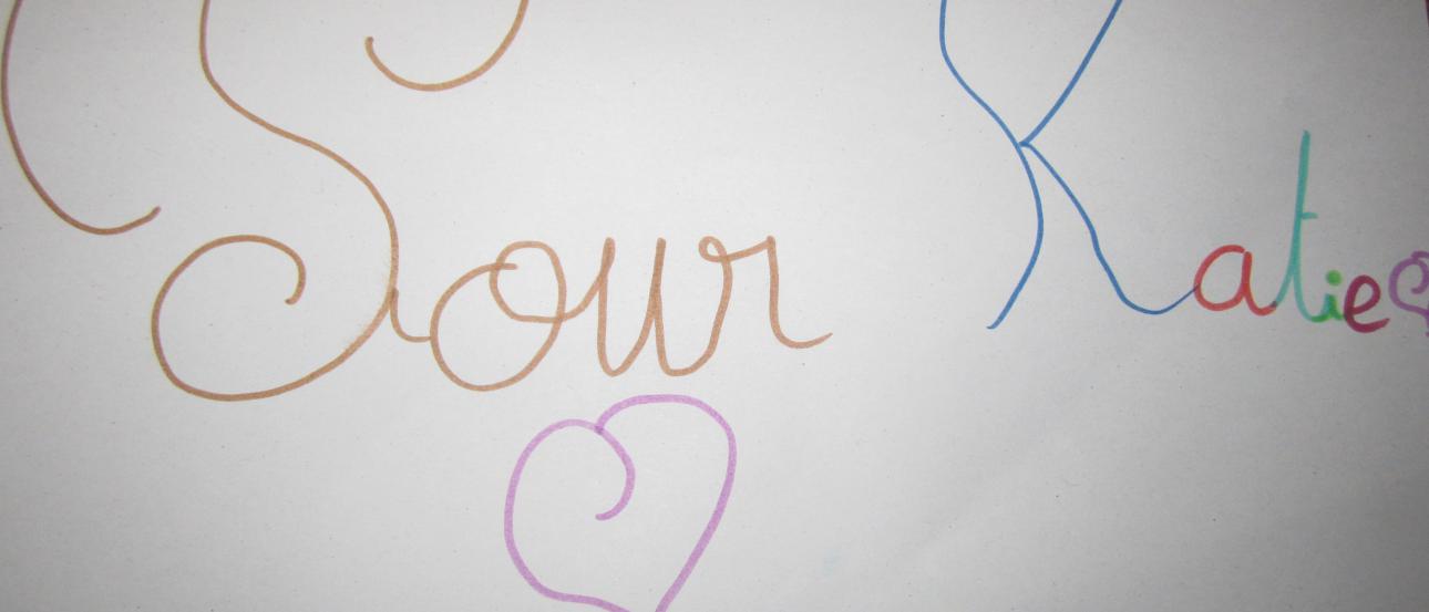 Canal with boats, lined with historic buildings on a sunny day. This alt text was added with Al; accuracy may vary.