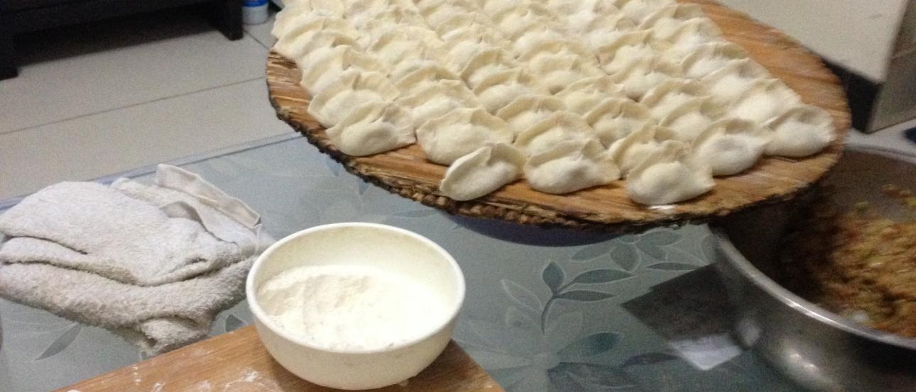 Ornate Chinese temple facade with colorful carvings and statues. This alt text was added with Al; accuracy may vary.