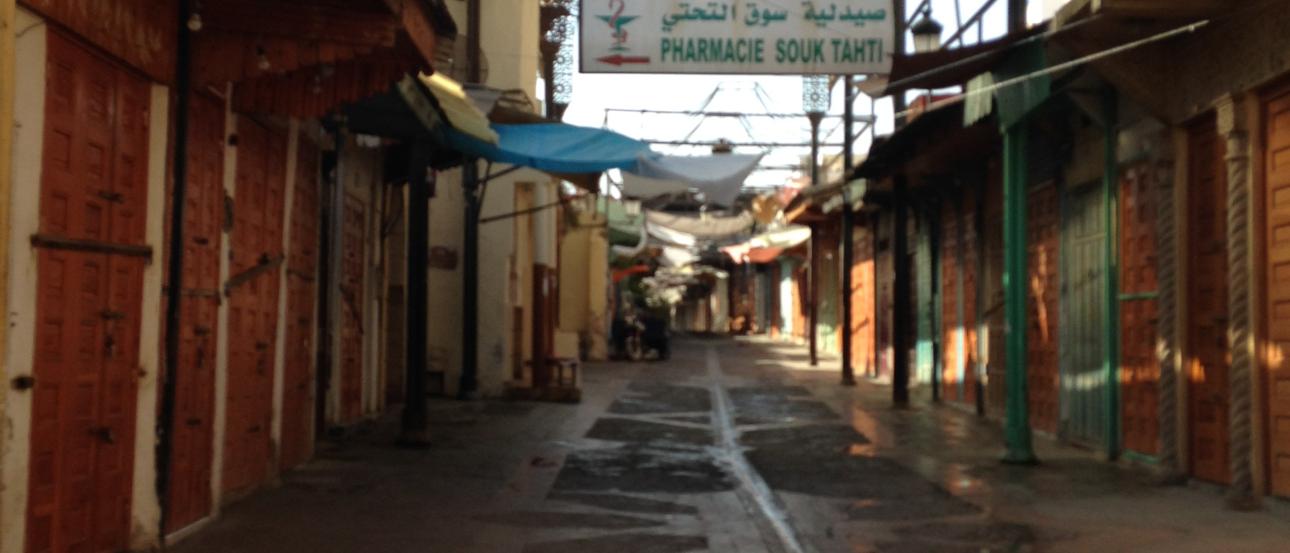 A group of people on a beach at sunset, posing and smiling. This alt text was added with Al; accuracy may vary.