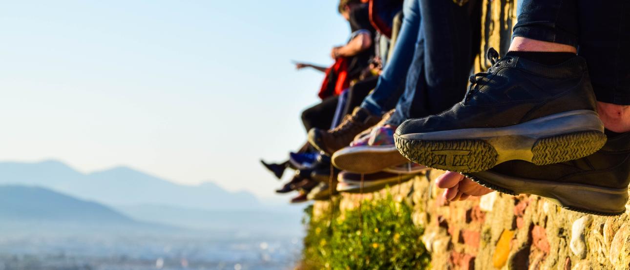 Blurred incense smoke rises before a traditional temple facade. This alt text was added with Al; accuracy may vary.