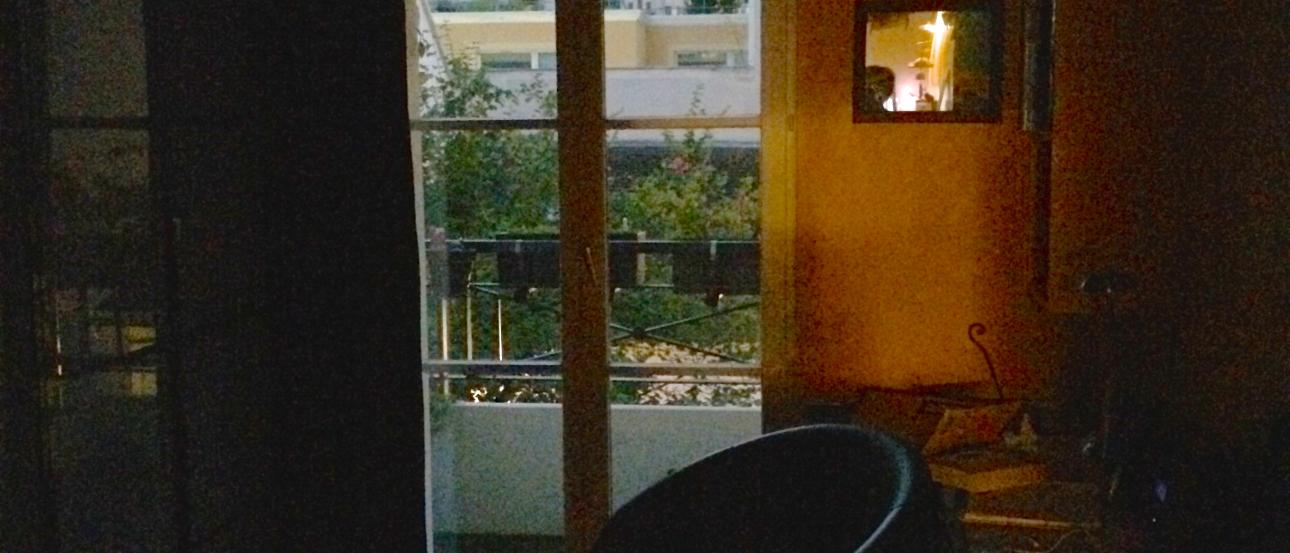 A brightly colored double-decker bus in a city setting with a historic building. This alt text was added with Al; accuracy may vary.