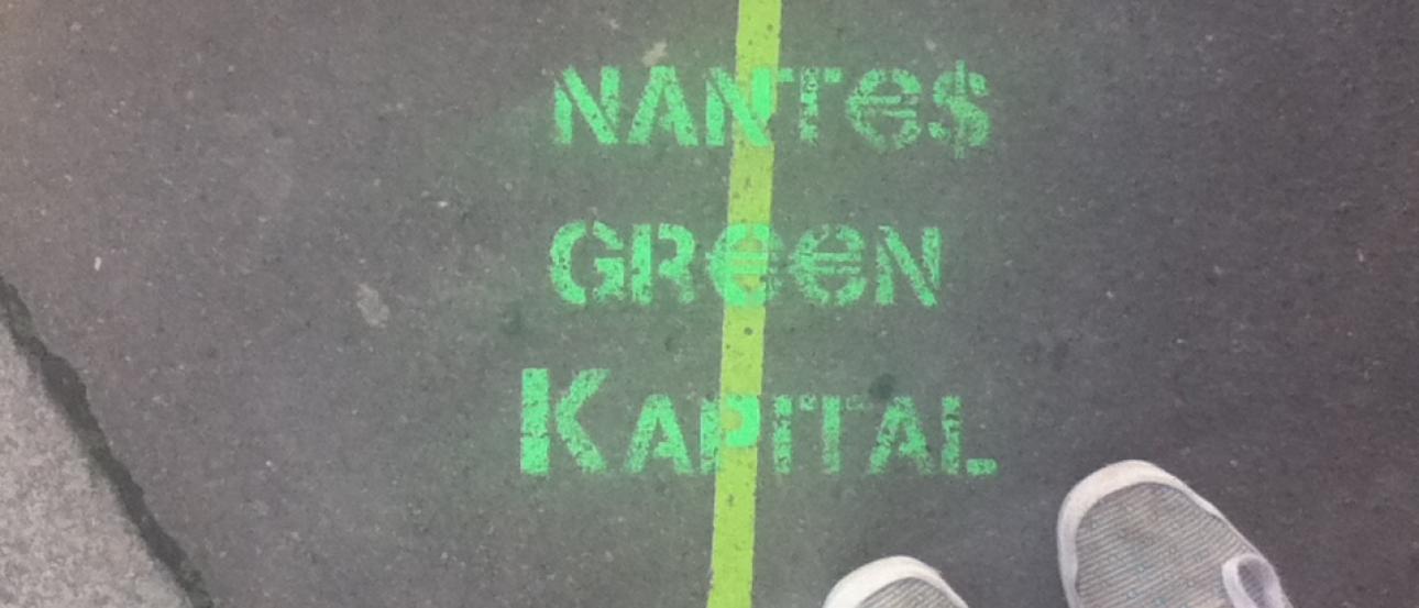 Canal in Amsterdam with boats and traditional houses under a blue sky. This alt text was added with Al; accuracy may vary.