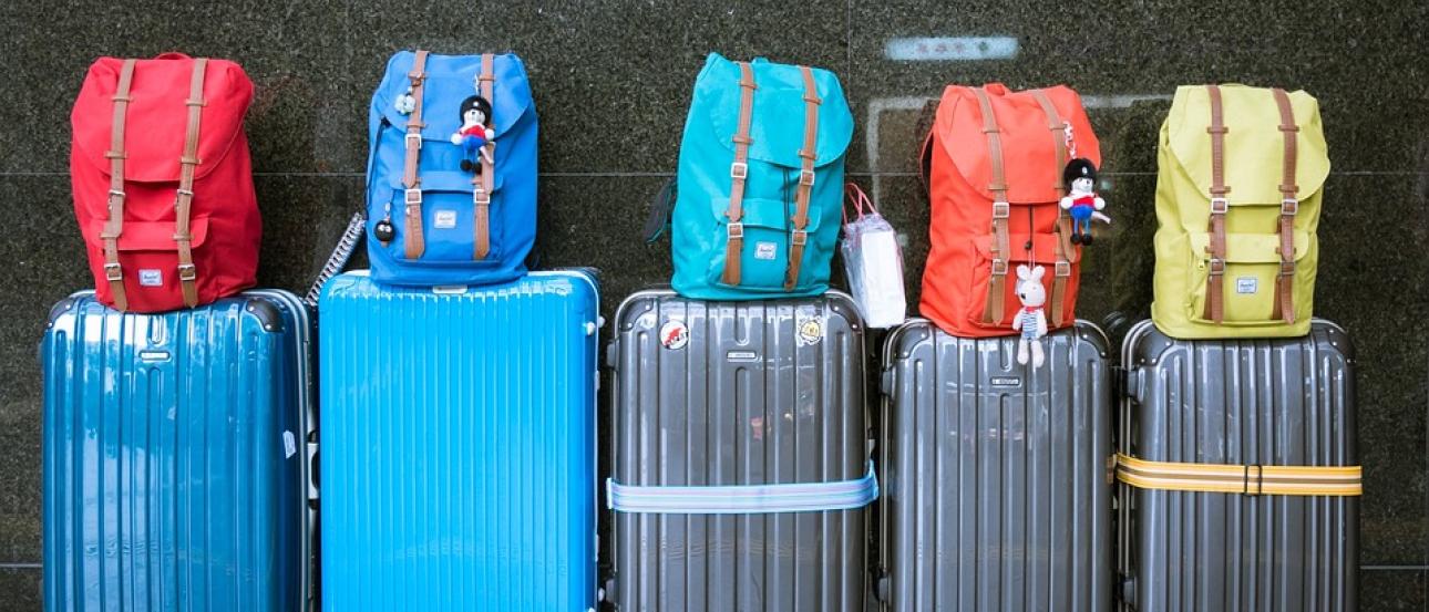 5 sets of luggage and carryons lined up