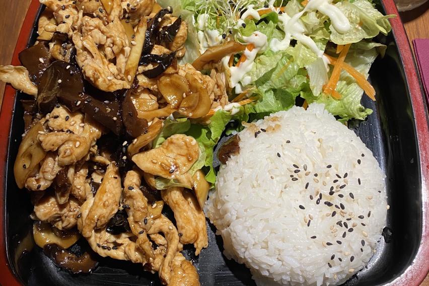 A bento box of chicken teriyaki with a side of white rice and a salad.