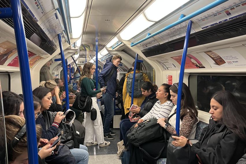 People are pictured sitting at the tube.
