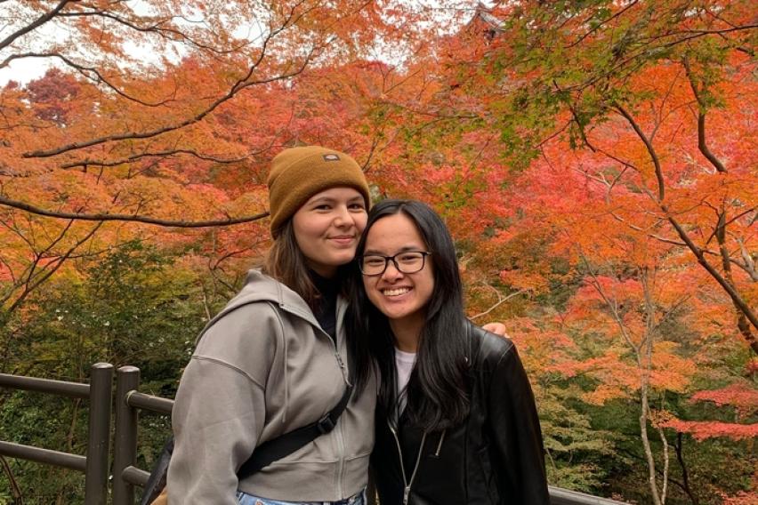 Kyoto, Japan Kinkakuji Temple fall leaves and friend 