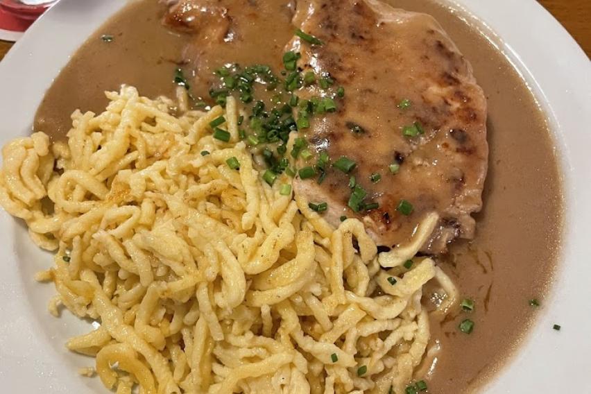 A plate of schnitzel and spaetzle