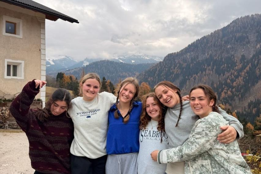 Group of girls smiling with a beautiful mountain view in the background