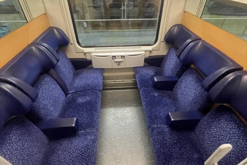 six seats in a train compartment
