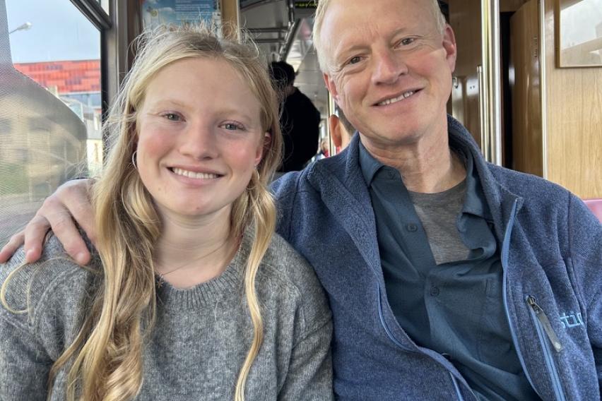 The author sits beside her father on one of Freiburgs historic trams
