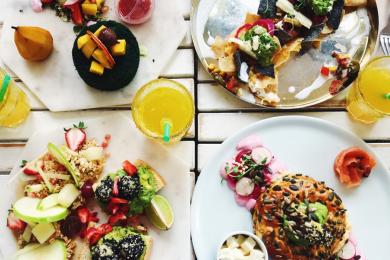 bright colorful foods on many dishes viewed from above