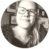 Amy Ruhter McMillan smiles while wearing glasses