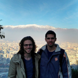 students standing with a mountain background