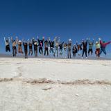 students jumping in a line in Jujuy salt flats