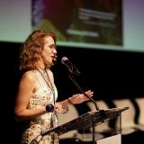 Samantha Stidham on stage giving her acceptance speech at the 2023 IES Abroad Film Fest