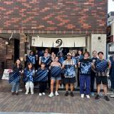 Students posing with their artwork in Tokyo