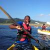 a student poses for a fun photo while kayaking in South Africa
