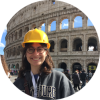 A photo of a student standing near the Colosseum in Rome 