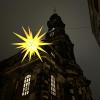 Star-shaped lantern hangs in front of church