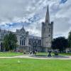 A photo of the fountain and lawn in St. Patrick’s Park with St. Patrick’s Cathedral in the background.