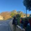 Image of three students walking to school with backpacks on with the iconic devils peak and table mountain in the background. 
