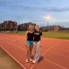 My friend Kensi and I at the track after running wickets, smiling for the camera at sunset