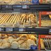An image of Hofer's Bakery section, with various breads and sales.