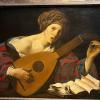 A photograph of the painting "Woman Playing the Lute" by Hendrick ter Brugghen from the Kunsthistorisches Museum in Vienna, Austria.