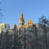 A building on Passeig de Gràcia reflecting the setting sun.