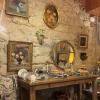 Brick wall of a cafe interior decorated with picture frames and knicknacks