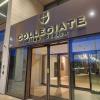 The entrance of Collegiate Milan Bovisa with keycard access doors and a reception area.