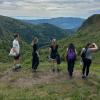 5 people face the backdrop of Vosges mountains