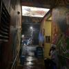 Picture of a dark alley with a chef on their smoke break.