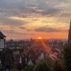 Sunset in Freiburg, the Munster and Schwabentor are visible
