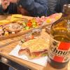 cutting board, ichnusa, and a proscuitt sandwich