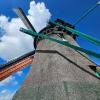 An upward capture of a Zaanse Schans windmill from its base. 
