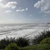A landscape view of the crashing waves of the West Coast.