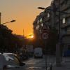The sun setting in the Nou Barris neighborhood in Barcelona, Spain.