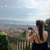 Girl taking picture of view of Barcelona from Bunkers del Carmel