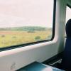 View looking out the window of a train in Ireland
