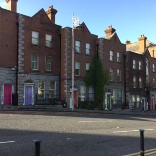 Brick row houses with colorful doors in Dublin