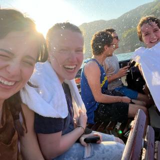 students splashed with water on ferry ride on lake como