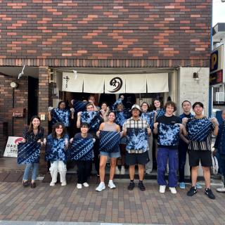Students posing with their artwork in Tokyo