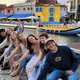 Students smiling on canal