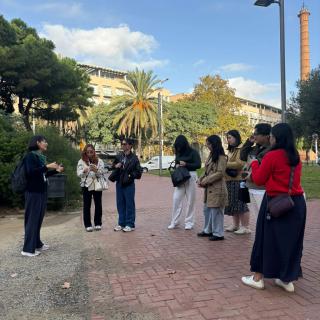FEU students listening to faculty on a walking tour