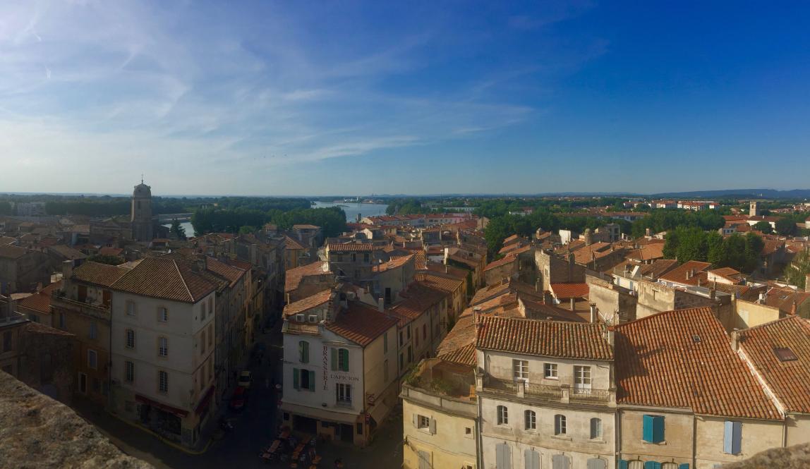 a view over building rooftops in Arles