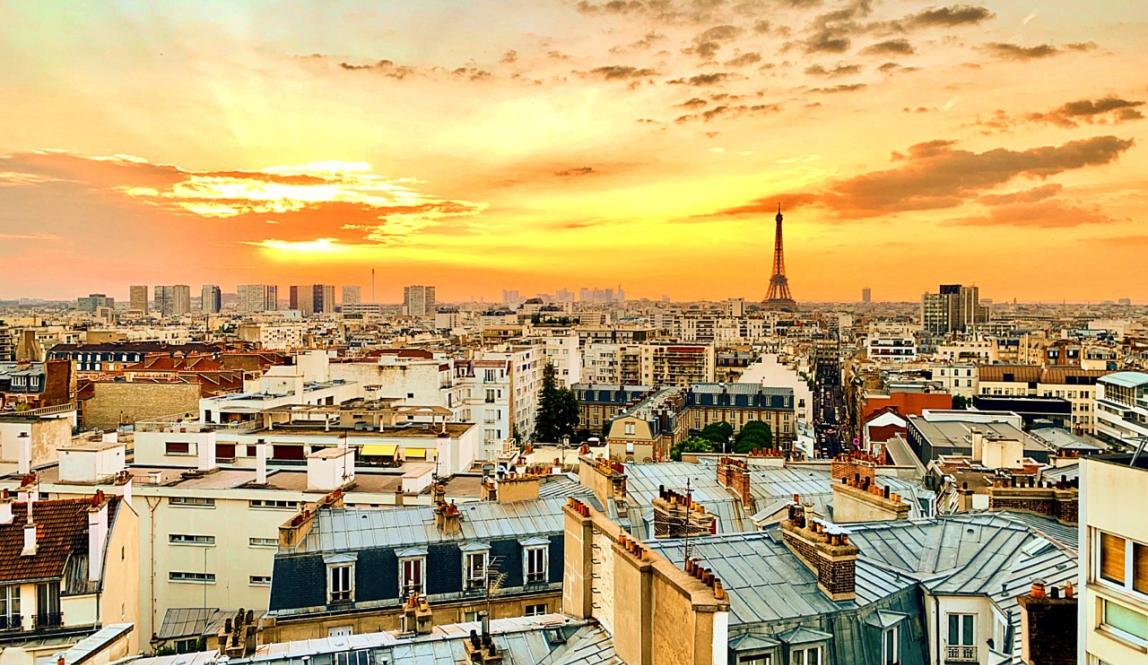 a view of Paris from the rooftop during sunset